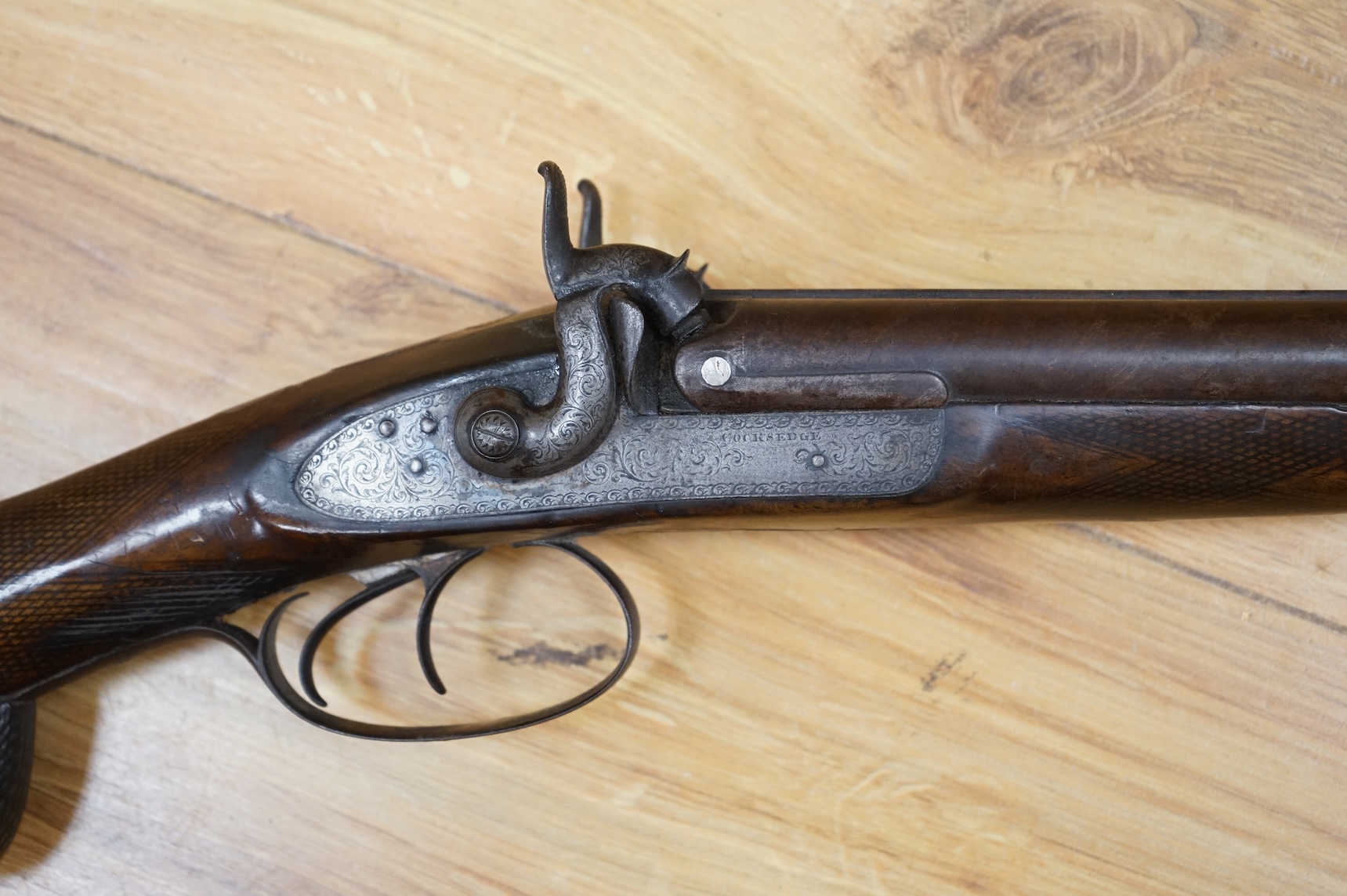 A 1907 bayonet in its scabbard with the tip of the blade shortened, together with a Glengarry cap of the KOSB, post 1902 badge and a brown leather shoulder belt and pouch with QE2 bronze badge of the Royal Artillery